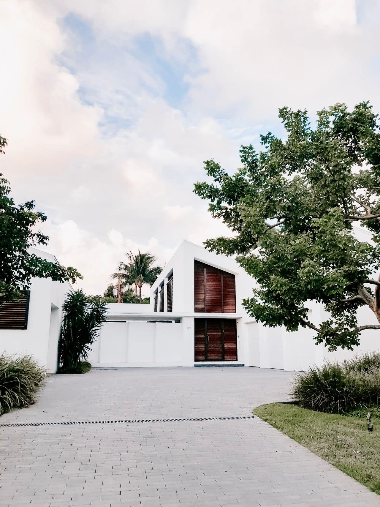 A completed TEP Builders home with tropical landscaping