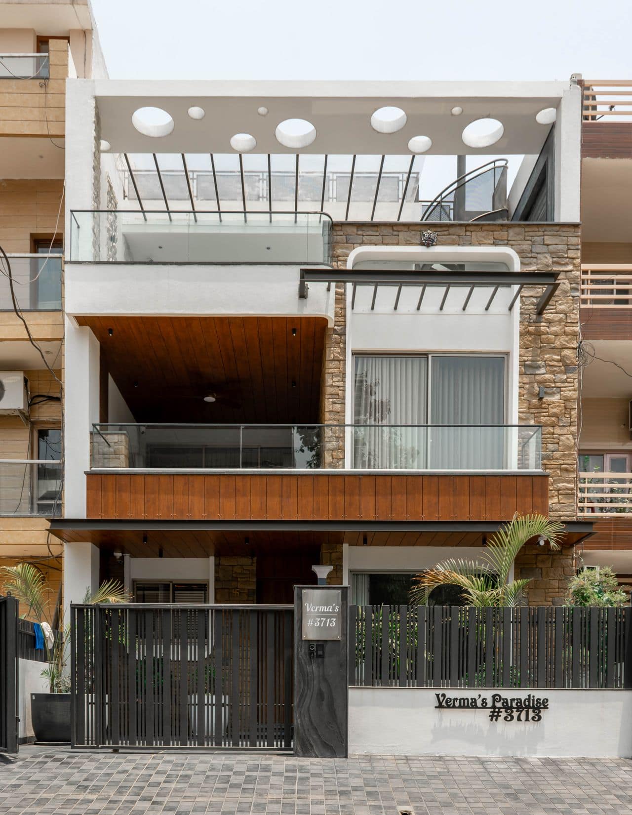 Contemporary beachside home with timber and white render facade at dusk
