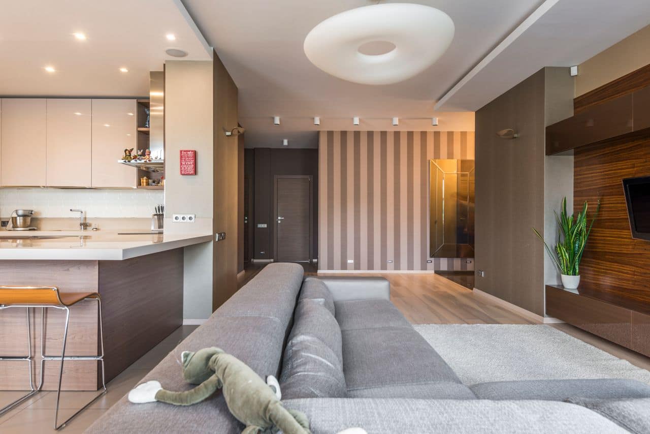 Renovated open-plan living and kitchen with timber accents