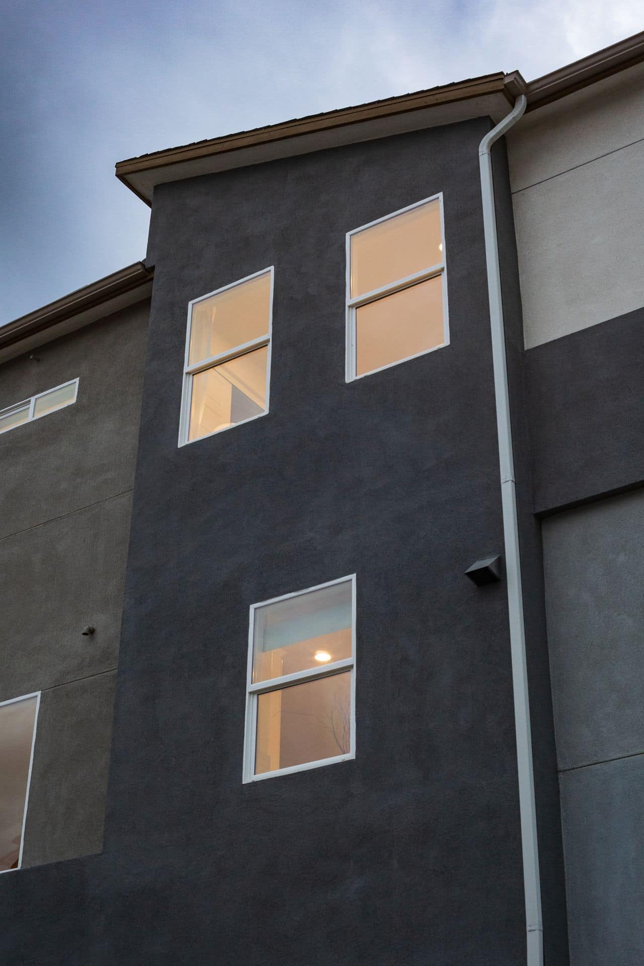Modern second-storey home extension with timber screening